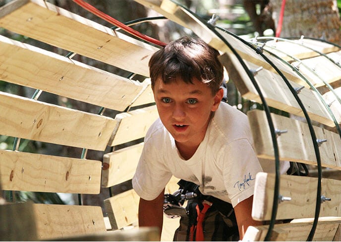 Young boy Chutes & Ladders tunnel element